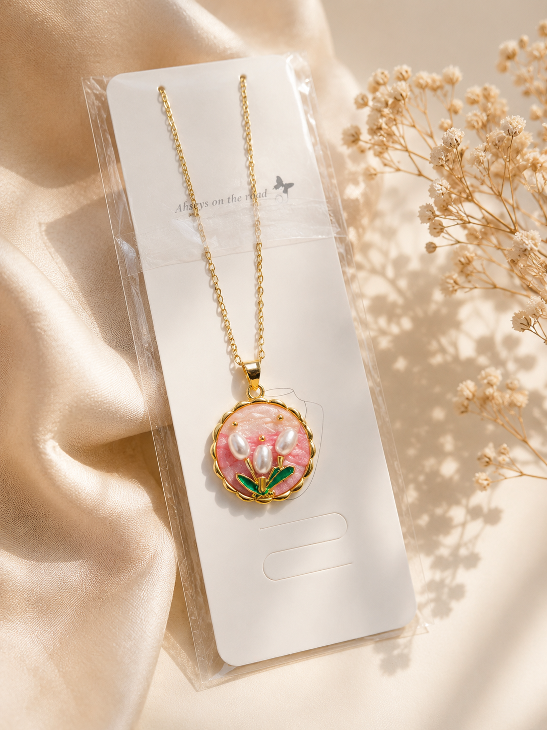 Zinmeerjewells stainless steel floral necklace featuring a pink enamel medallion with a pearl necklace for women tulip design, showcasing premium anti tarnish jewelry Pakistan.