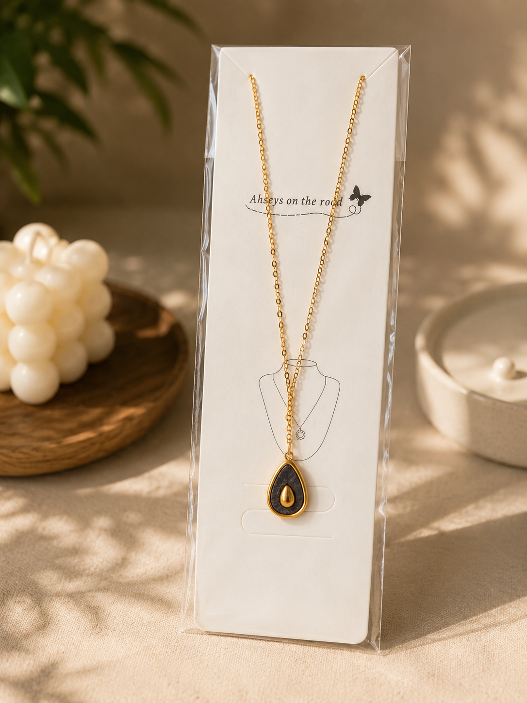 Zinmeerjewells gold pendant featuring a unique pinterest style pendant with a black stone necklace teardrop design, highlighting premium anti tarnish jewelry Pakistan.
